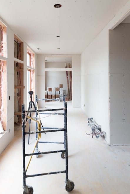 a room being remodeled with construction equipment in it