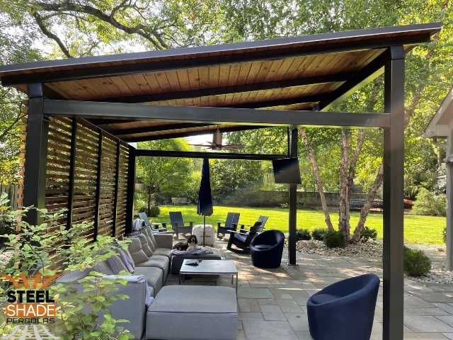 a slanted roof pergola with paver flooring and seating in a backyard located in Clarendon Hills, IL